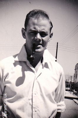 Sid Coombs September 1958 smoking pipe