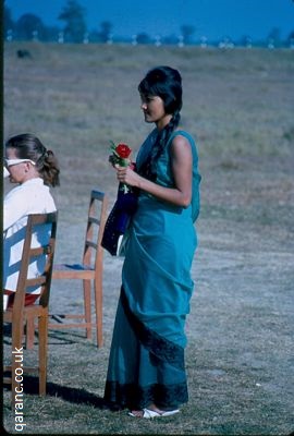 Nepalese woman carrying flower